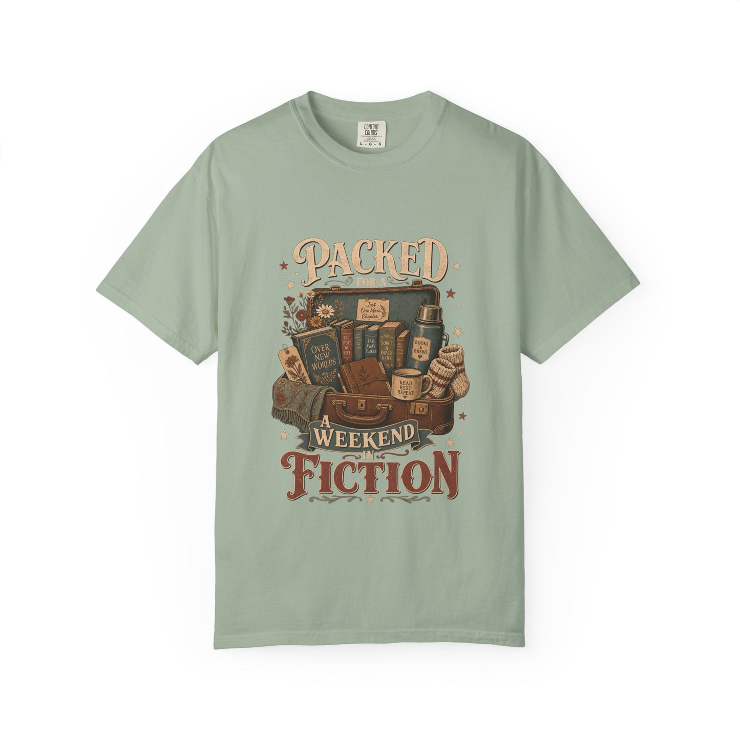 Packed for a Weekend in Fiction Book Lover Shirt printed on a Comfort Colors 1717 Bay garment-dyed T-shirt front view featuring a vintage suitcase filled with books, a cosy blanket, journal and reading essentials.
