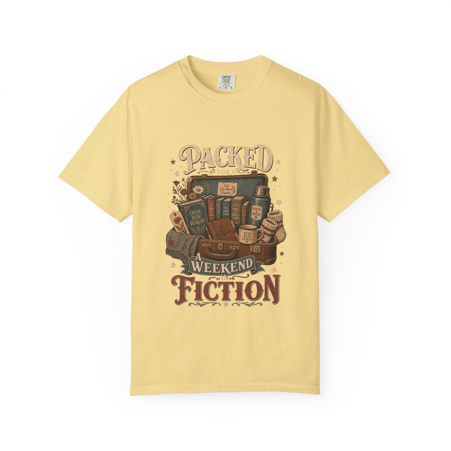 Packed for a Weekend in Fiction reading T-shirt in Butter featuring a vintage suitcase packed with books, a mug, thermos and cozy socks