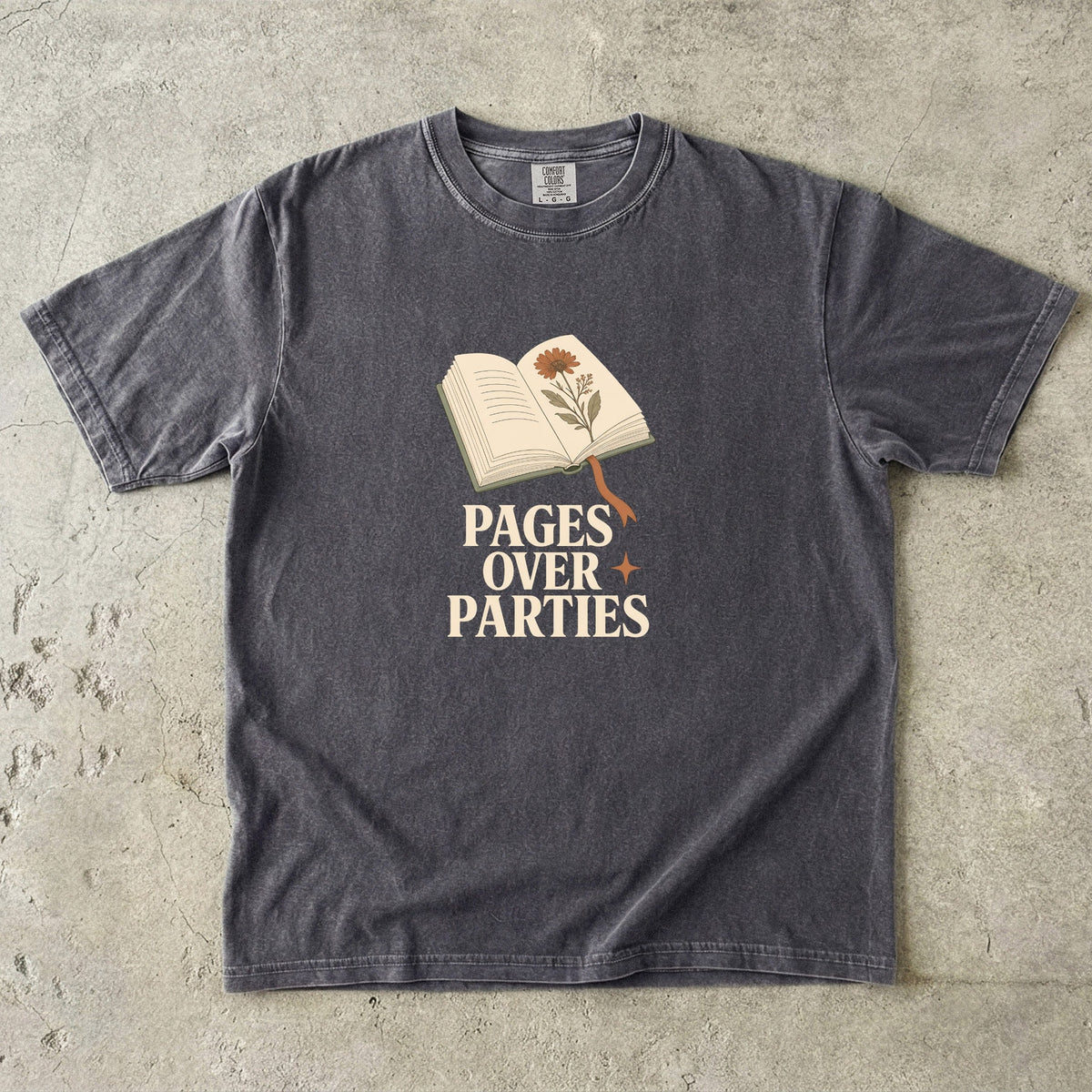 Pages Over Parties introvert reader shirt in Pepper featuring an open book, flower and minimalist literary artwork.