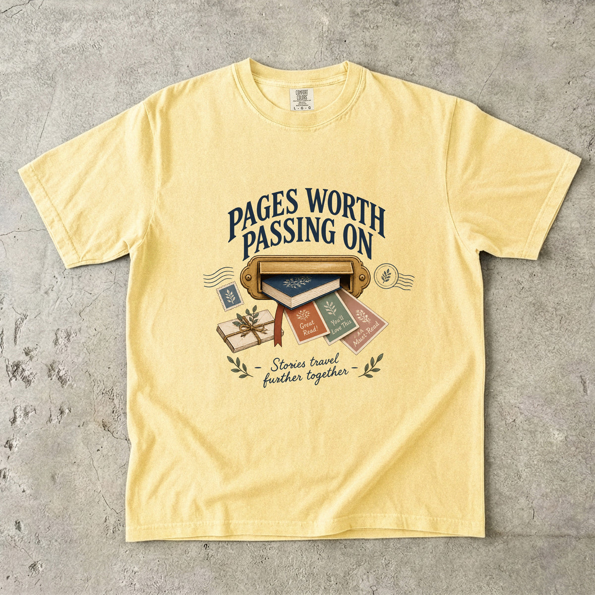 Butter book lover T-shirt with “Pages Worth Passing On,” a mail slot, book and recommendation cards