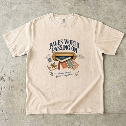 Ivory book lover T-shirt with “Pages Worth Passing On,” a mail slot, book and recommendation cards