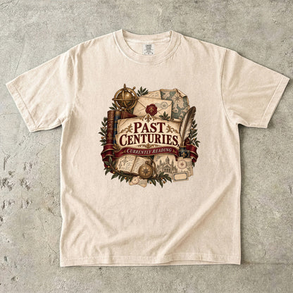 Ivory literary T-shirt with “Past Centuries, Currently Reading,” antique-style books, letters and maps