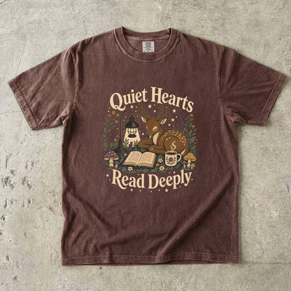 Front view of the Espresso Comfort Colors® Book Lover T-shirt featuring a peaceful woodland deer reading design with lantern and botanical details.
