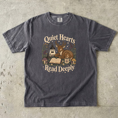 Front view of the Pepper Comfort Colors® Book Lover T-shirt featuring the Quiet Hearts Read Deeply woodland reading illustration.