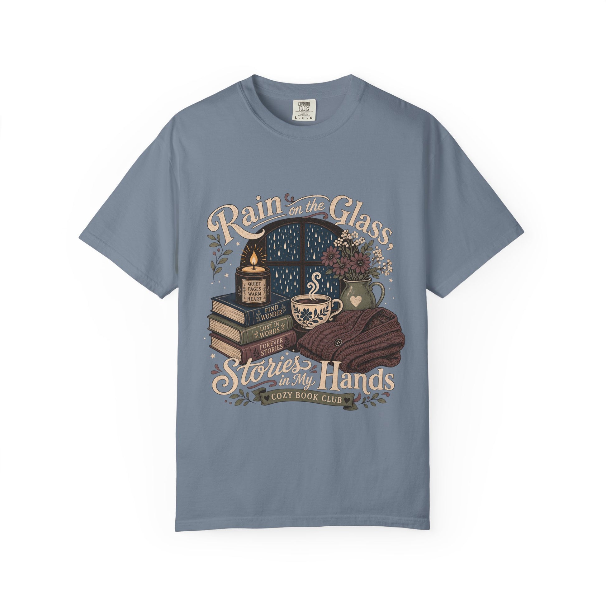 Rain on the Glass rainy day reading T-shirt with books, tea and candle design on Blue Jean.