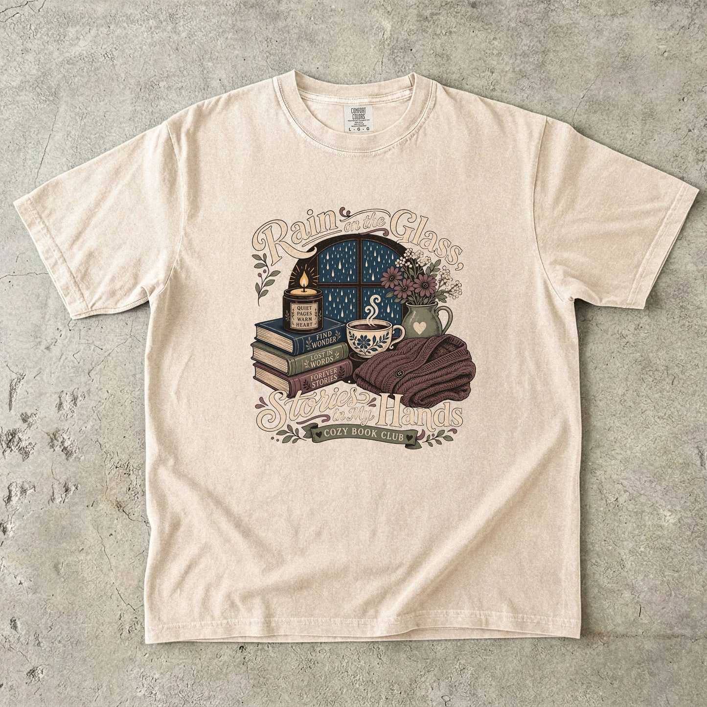 Rain on the Glass rainy day reading T-shirt with books, tea and candle design on Ivory.