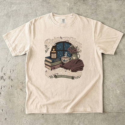 Rain on the Glass rainy day reading T-shirt with books, tea and candle design on Ivory.