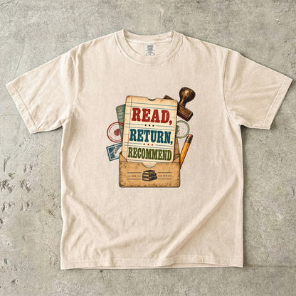 Ivory library lover T-shirt with “Read, Return, Recommend” on a vintage library-style card