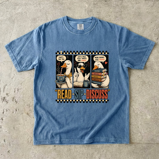 Blue Jean Comfort Colors Read Sip Discuss book club T-shirt featuring funny literary ducks, books and tea.