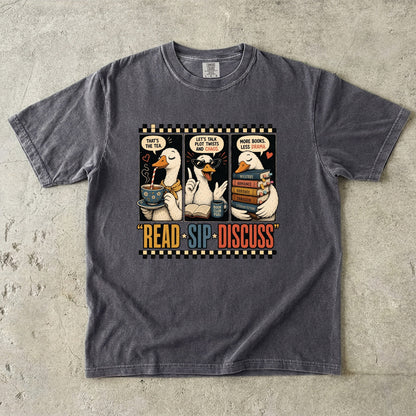 Pepper Comfort Colors Read Sip Discuss book club T-shirt featuring humorous reading ducks, books and tea.