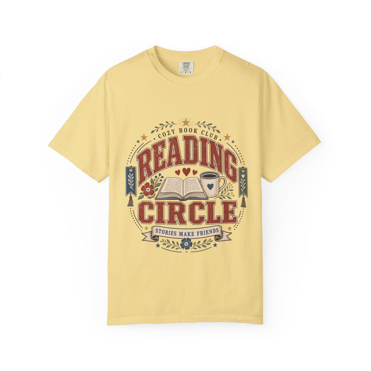 Reading Circle cozy book club T-shirt with open book, coffee mug, floral details, bookmarks and Stories Make Friends design on Butter.