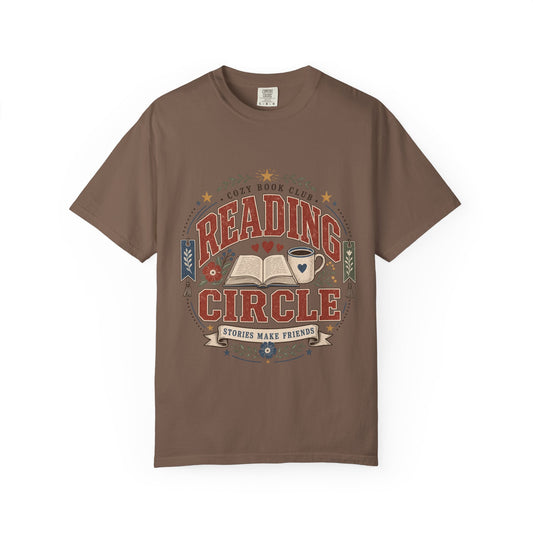 Reading Circle cozy book club T-shirt with open book, coffee mug, floral details, bookmarks and Stories Make Friends design on Espresso.