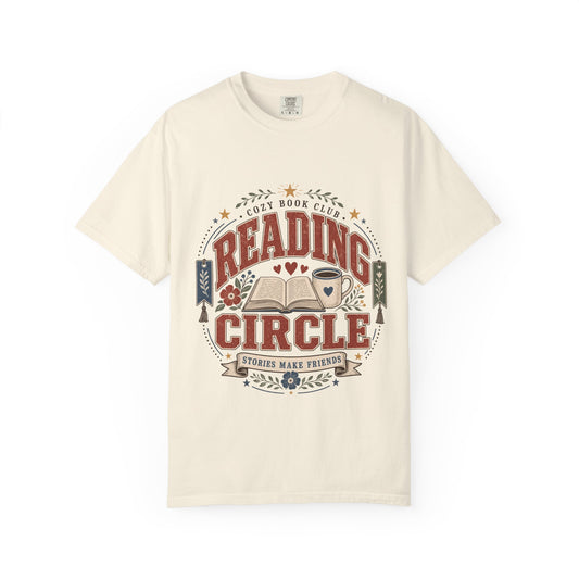 Reading Circle cozy book club T-shirt with open book, coffee mug, floral details, bookmarks and Stories Make Friends design on Ivory.