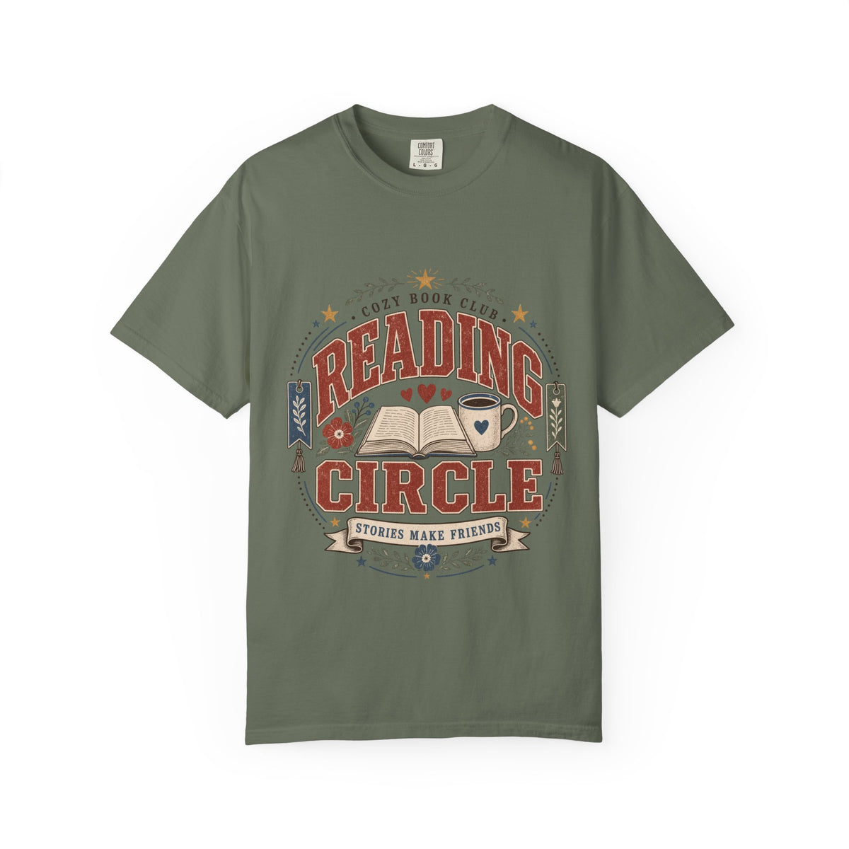 Reading Circle cozy book club T-shirt with open book, coffee mug, floral details, bookmarks and Stories Make Friends design on Moss.