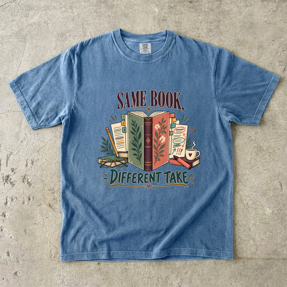 Blue Jean book club T-shirt with “Same Book, Different Take,” an open book and annotated pages