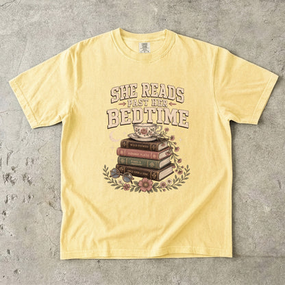 Butter reading T-shirt featuring She Reads Past Her Bedtime with stacked books, a floral teacup, flowers and crescent moon.