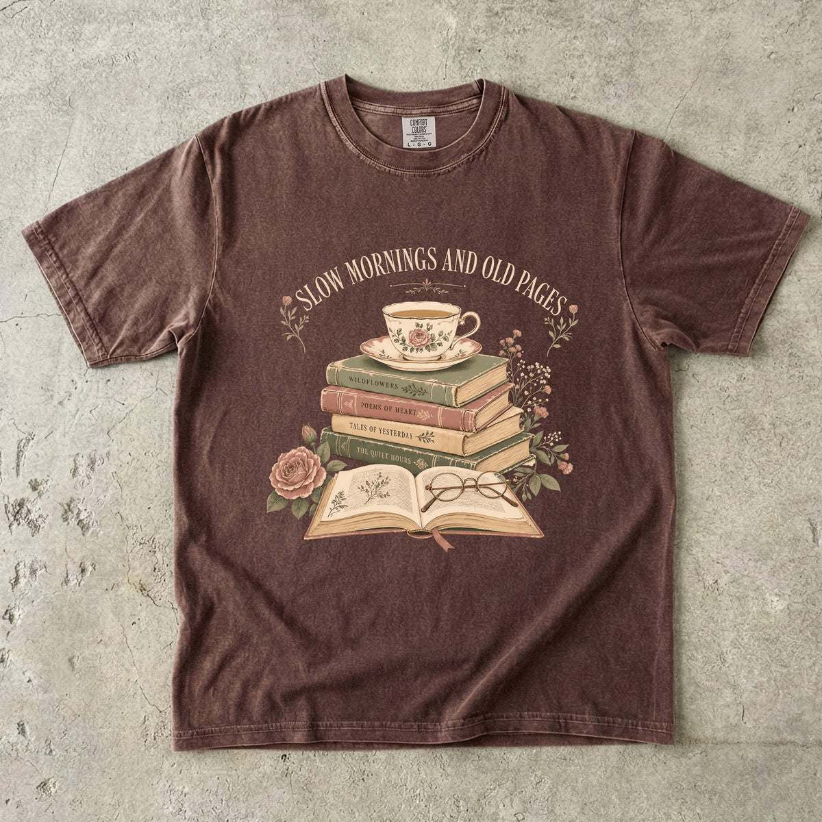 Espresso reading T-shirt featuring Slow Mornings and Old Pages with stacked vintage books, a floral teacup, open book, glasses and roses.