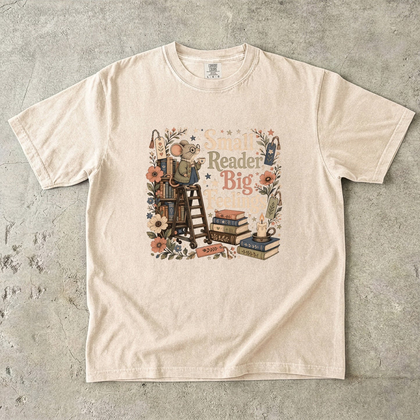 Small Reader, Big Feelings book lover T-shirt in Ivory featuring a mouse with books, flowers and a teacup