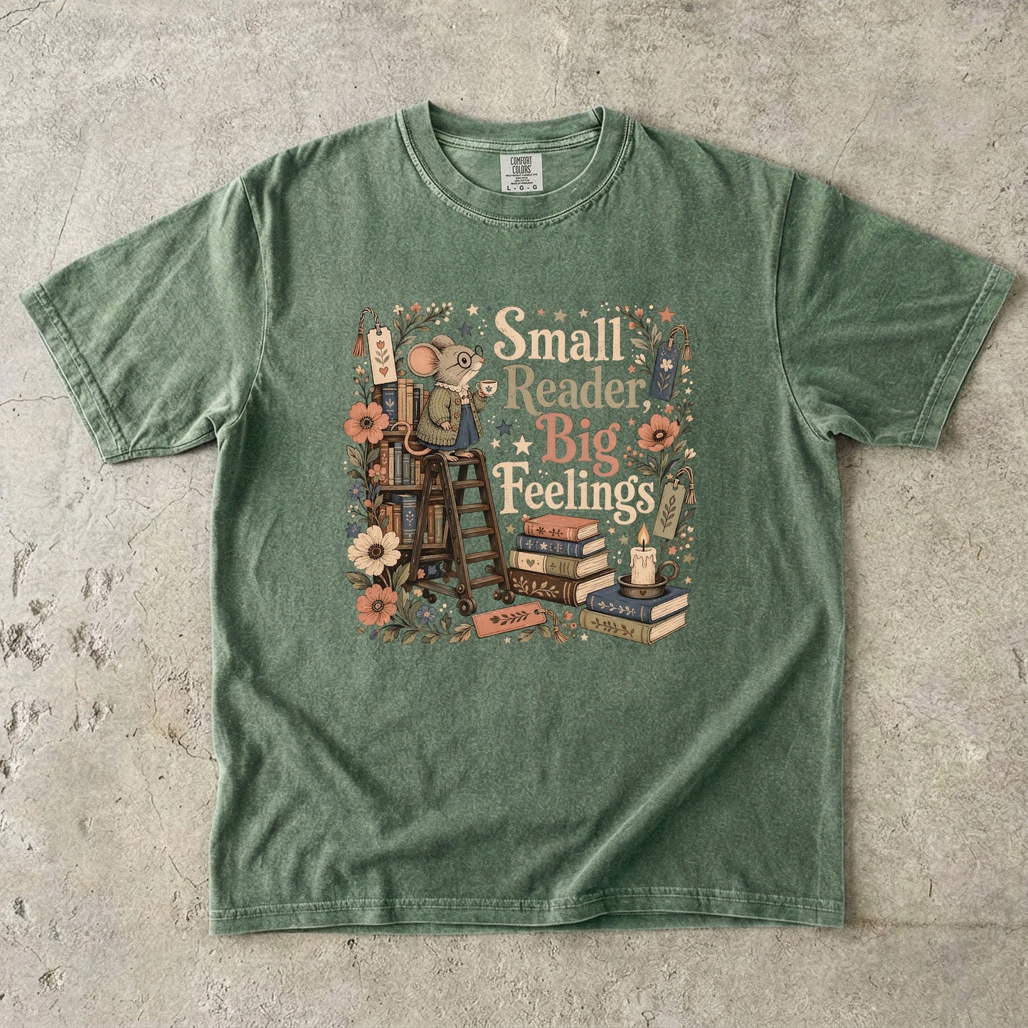 Small Reader, Big Feelings book lover T-shirt in Moss featuring a mouse with books, flowers and a teacup