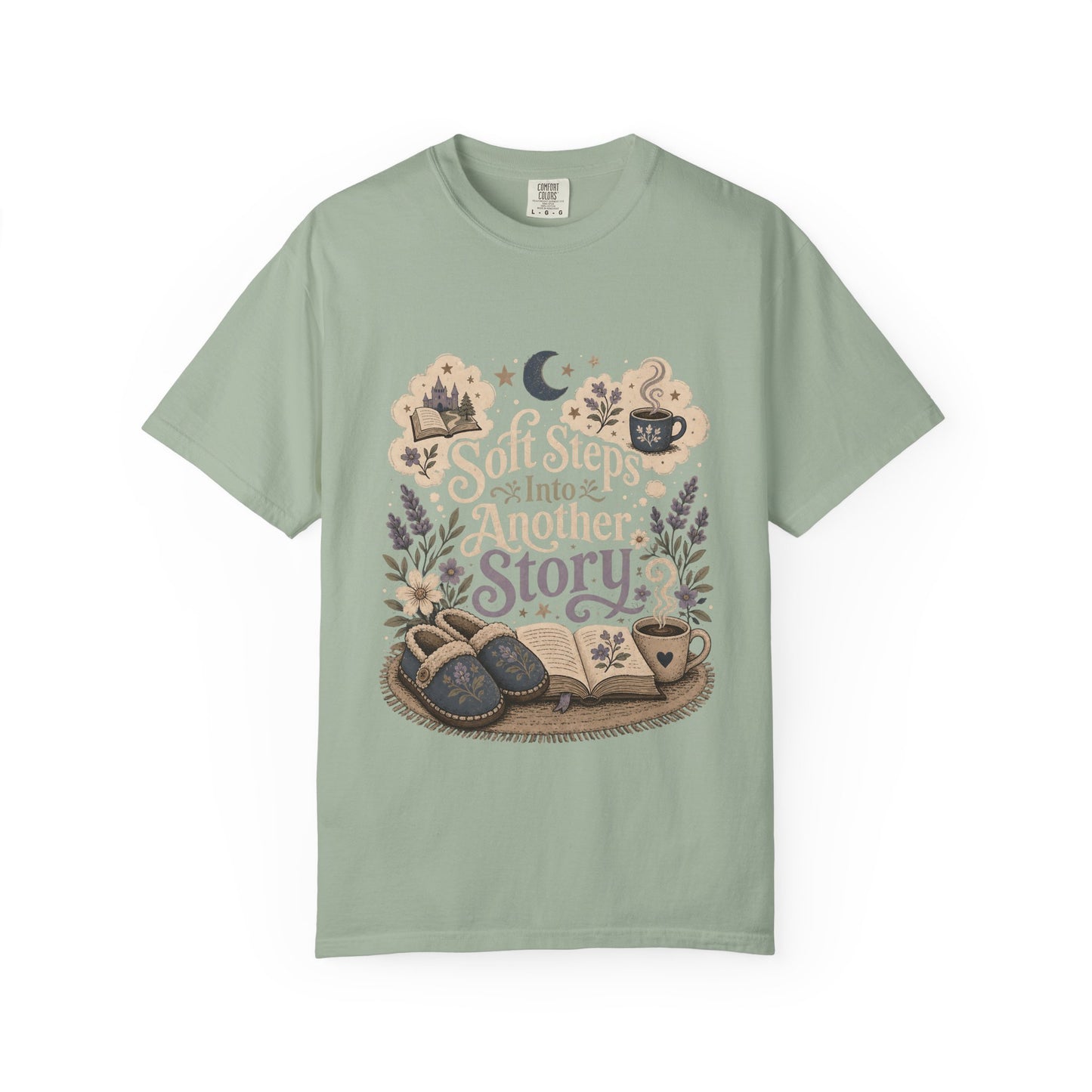Soft Steps Into Another Story book lover shirt on a Comfort Colors bay T-shirt featuring vintage-inspired artwork with books, cosy slippers, flowers and coffee mugs.


