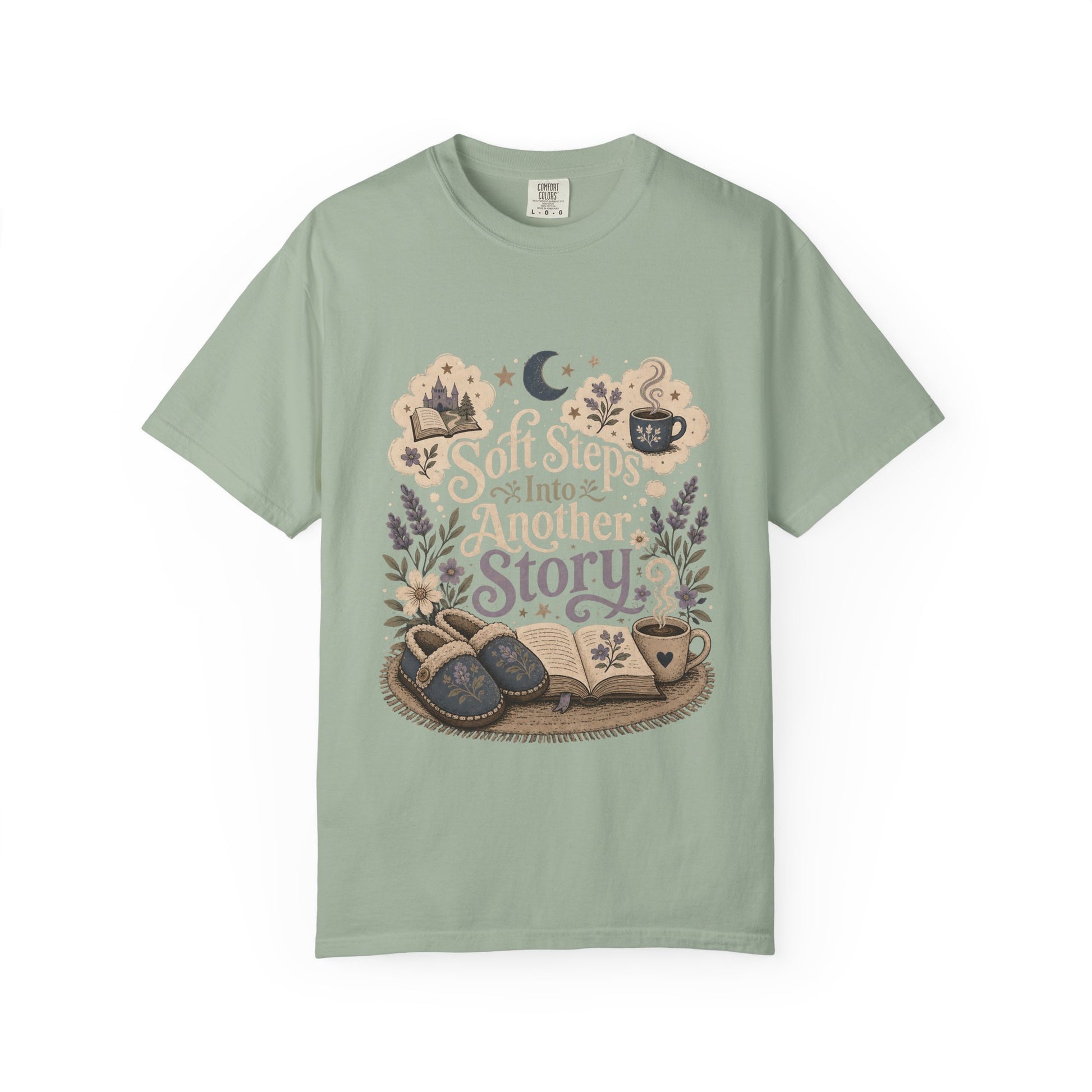 Soft Steps Into Another Story book lover shirt on a Comfort Colors bay T-shirt featuring vintage-inspired artwork with books, cosy slippers, flowers and coffee mugs.


