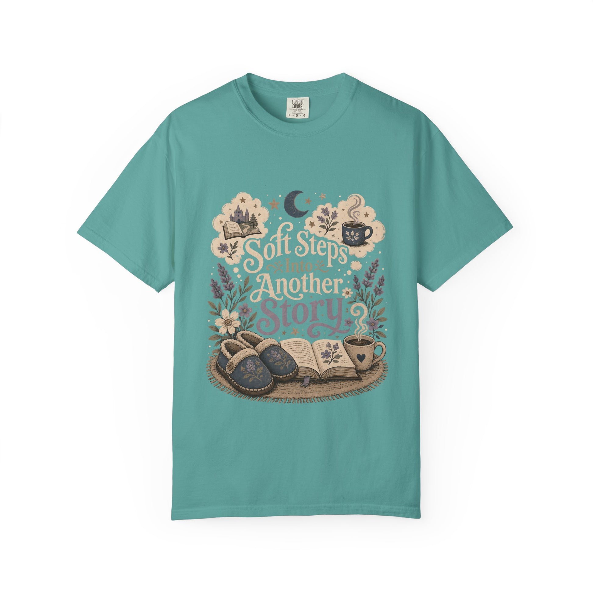 Soft Steps Into Another Story book lover shirt on a Comfort Colors seafoam T-shirt featuring vintage-inspired artwork with books, cosy slippers, flowers and coffee mugs.

