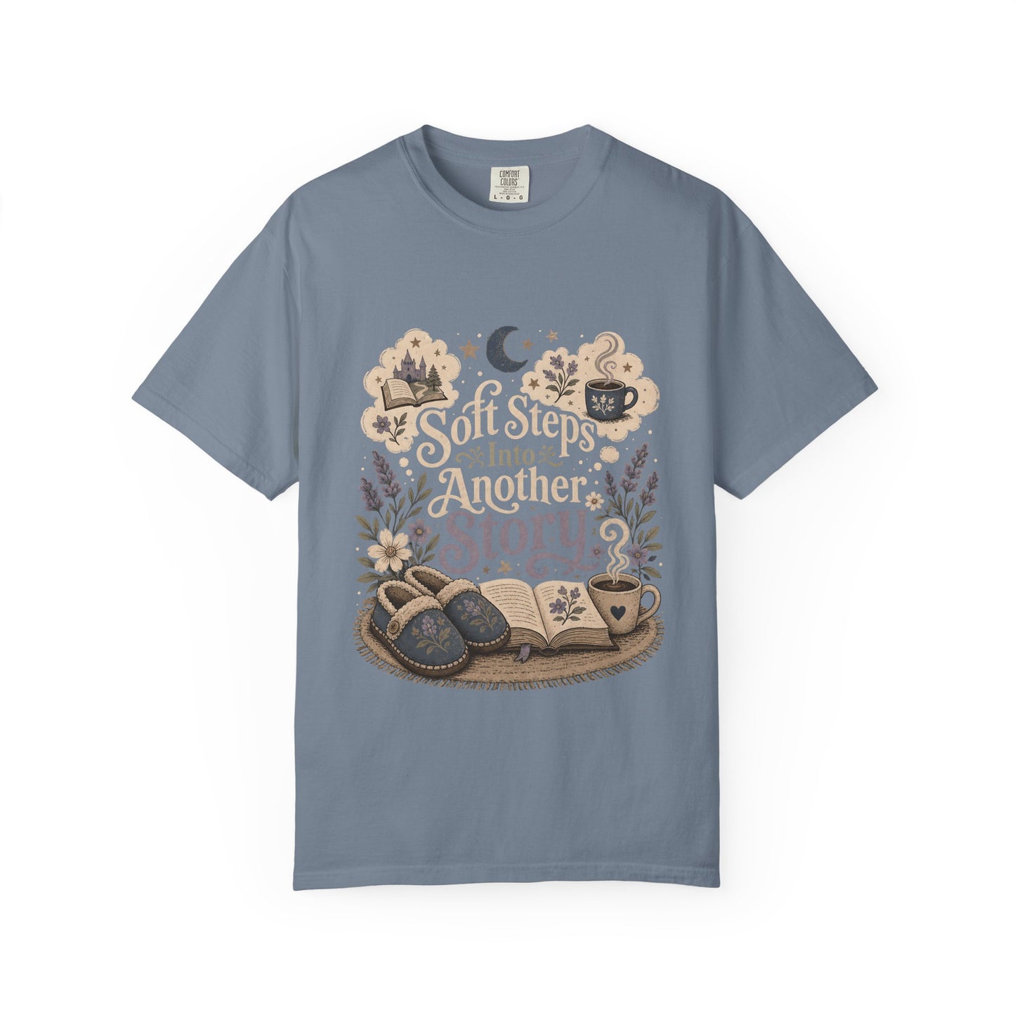 Soft Steps Into Another Story cozy reading T-shirt in Blue Jean featuring slippers, an open book, flowers and a warm drink