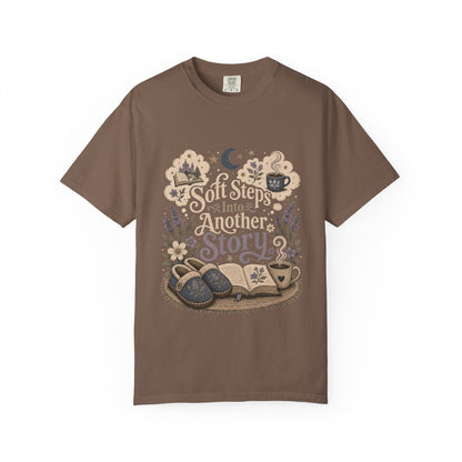 Soft Steps Into Another Story cozy reading T-shirt in Espresso featuring slippers, an open book, flowers and a warm drink