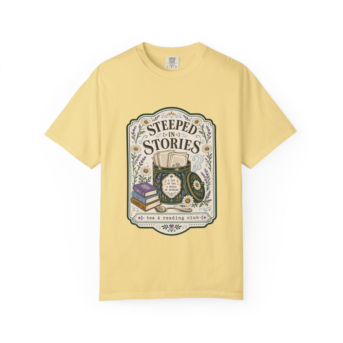 Steeped in Stories tea and reading club T-shirt featuring books, a floral tea tin, daisies and lavender on Butter.