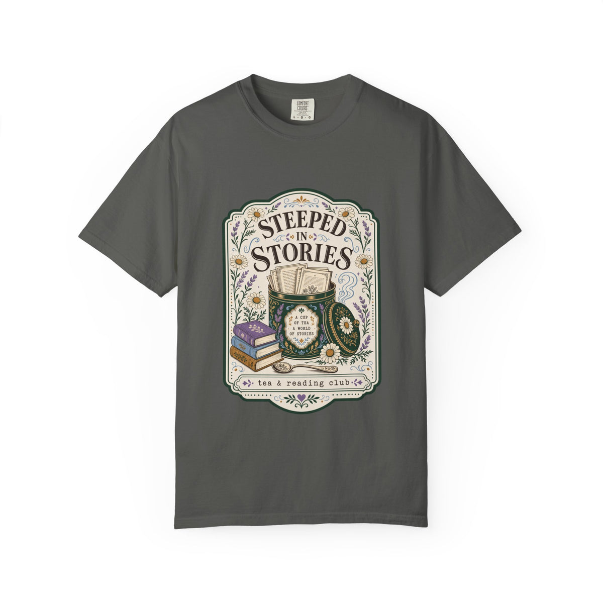 Steeped in Stories tea and reading club T-shirt featuring books, a floral tea tin, daisies and lavender on Pepper.