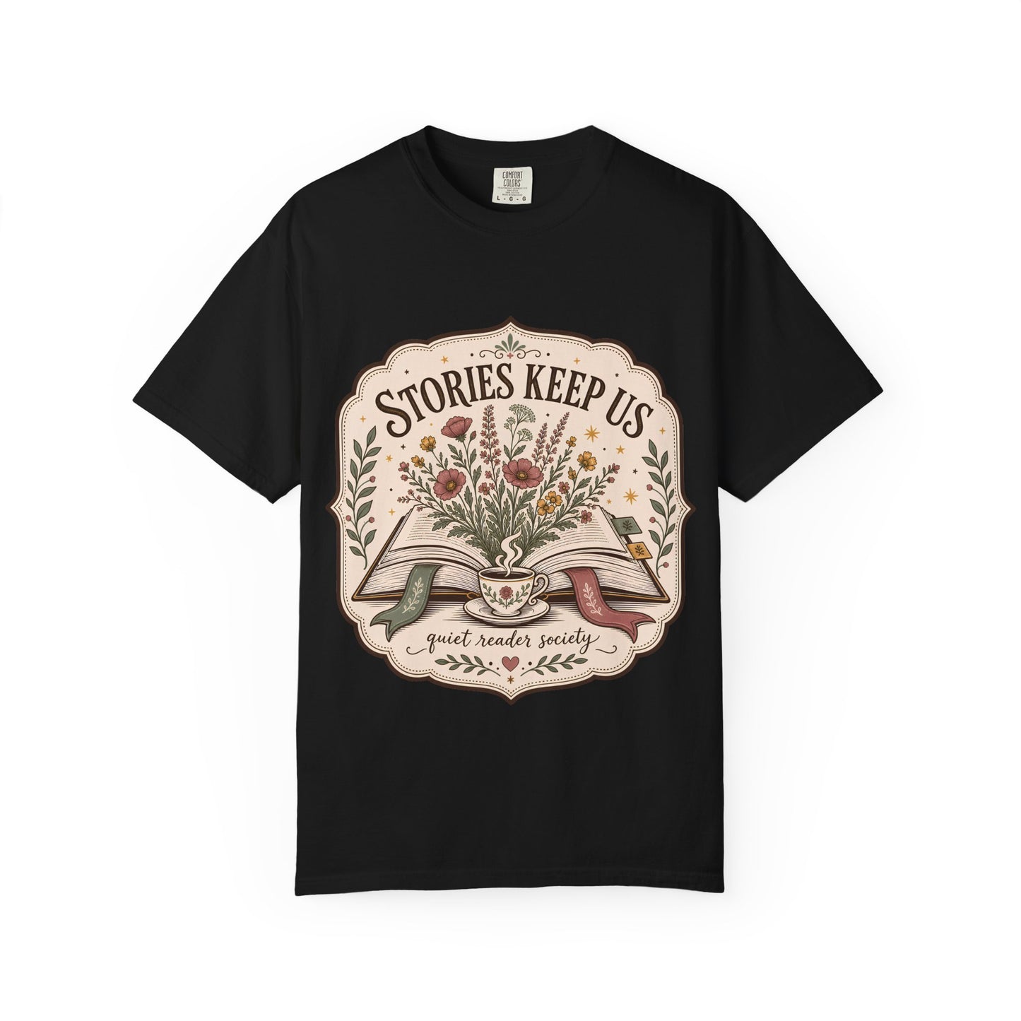 Front view of the Stories Keep Us vintage book lover graphic T-shirt in black printed on Comfort Colors 1717 heavyweight cotton.