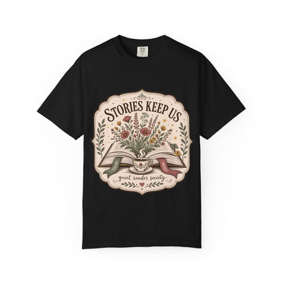 Front view of the Stories Keep Us vintage book lover graphic T-shirt in black printed on Comfort Colors 1717 heavyweight cotton.