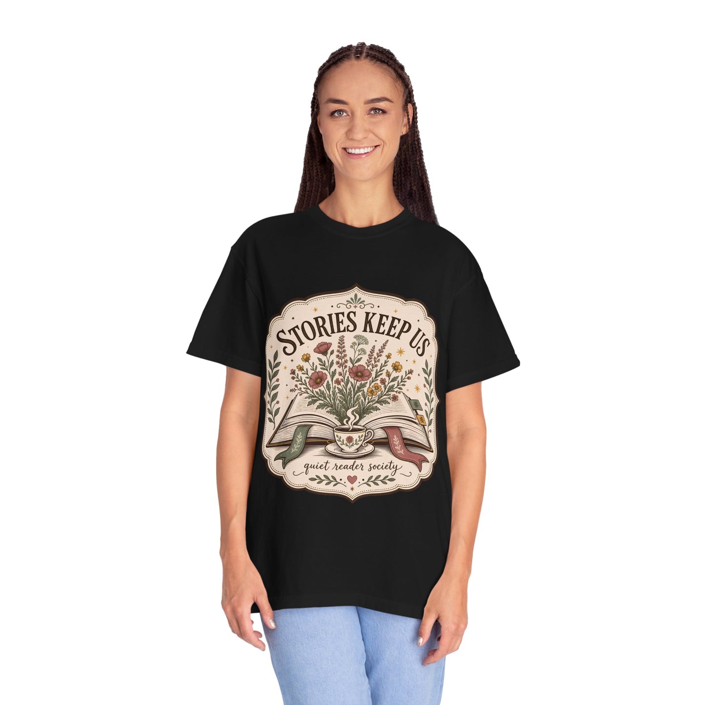 Woman wearing the Stories Keep Us vintage book lover T-shirt in black by Flourish Creation Labs, inspired by reading, books and literary life.