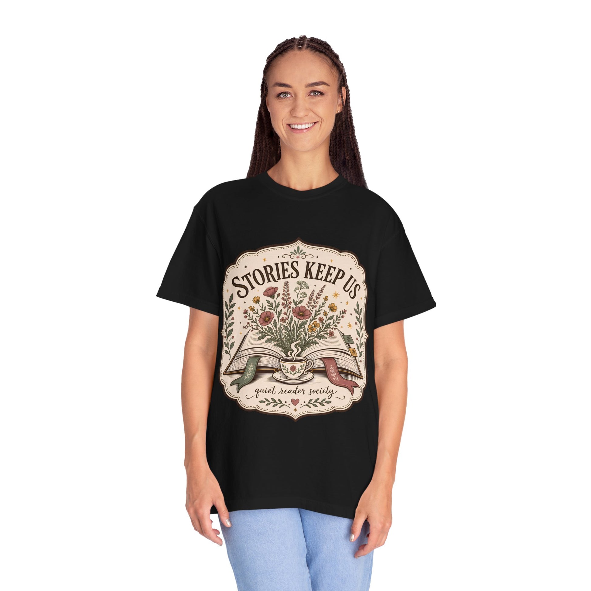Woman wearing the Stories Keep Us vintage book lover T-shirt in black by Flourish Creation Labs, inspired by reading, books and literary life.