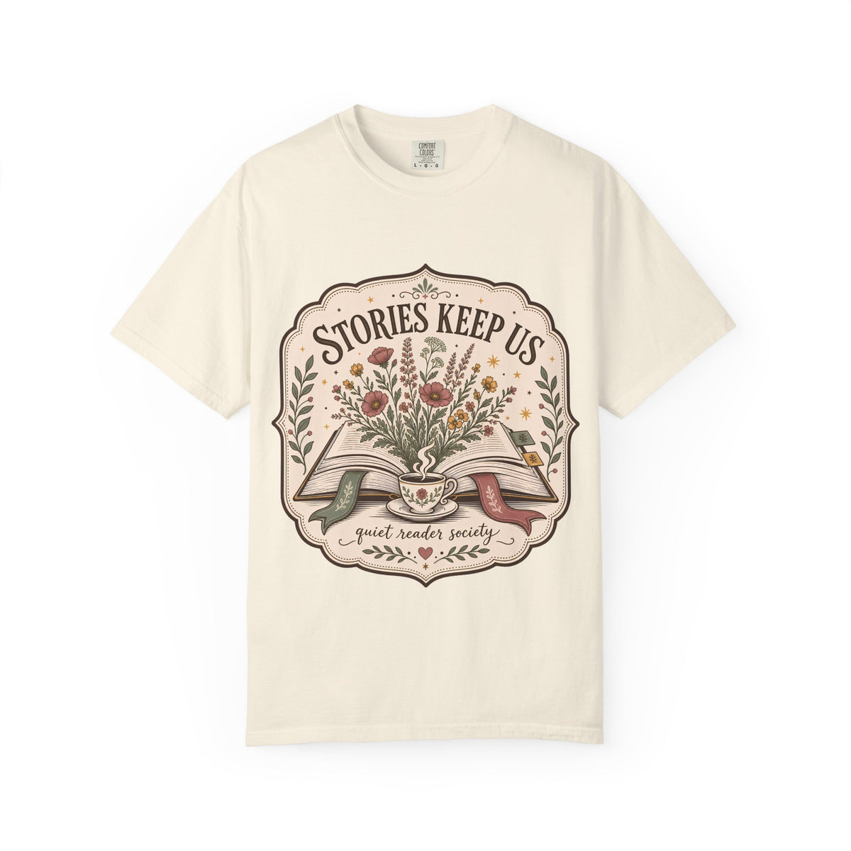 Stories Keep Us Quiet Reader Society shirt in Ivory featuring an open book, wildflowers and a floral teacup.
