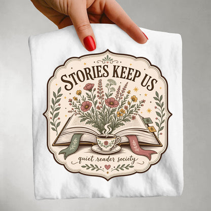 Woman wearing the Stories Keep Us white book lover T-shirt inspired by reading, stories and literary life.