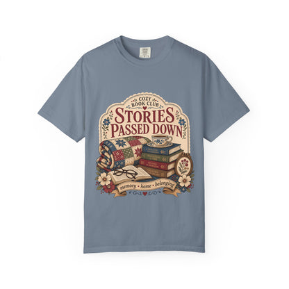 Stories Passed Down literary T-shirt with books, a patchwork quilt and floral keepsakes on Blue Jean.