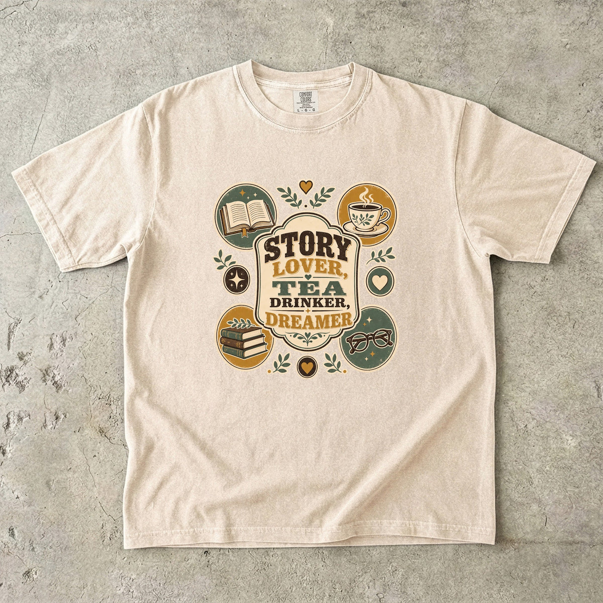 Story Lover Tea Drinker Dreamer book lover shirt in Ivory featuring tea, books, reading glasses and retro emblems.