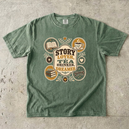 Story Lover Tea Drinker Dreamer book lover shirt in Moss featuring books, teacup, reading glasses and vintage emblems.