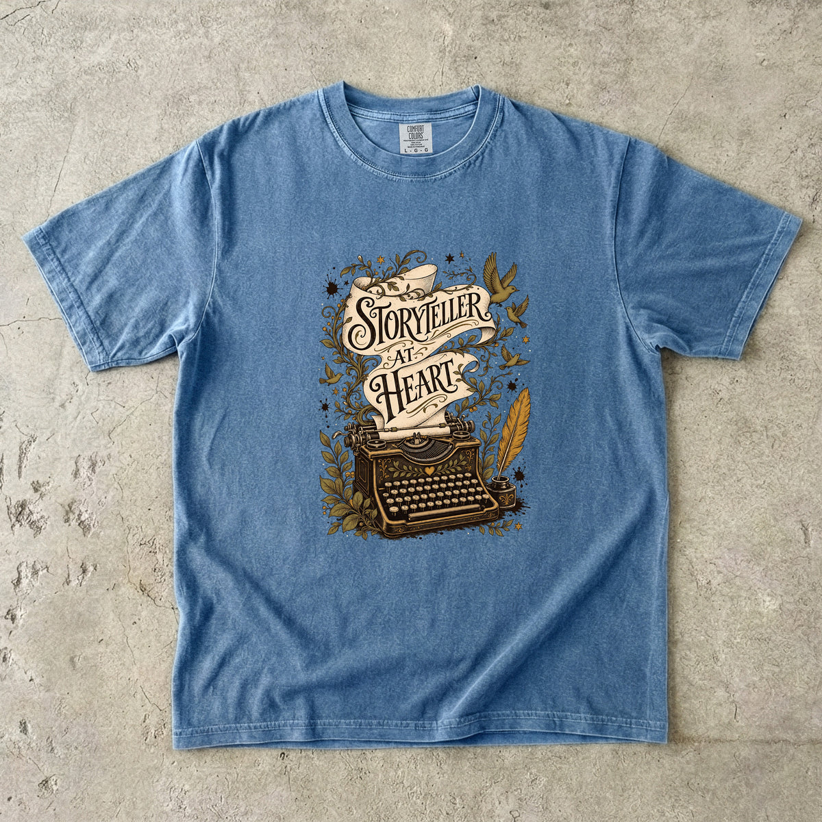 Storyteller at Heart writer shirt in Blue Jean with vintage typewriter and decorative storytelling artwork for writers.