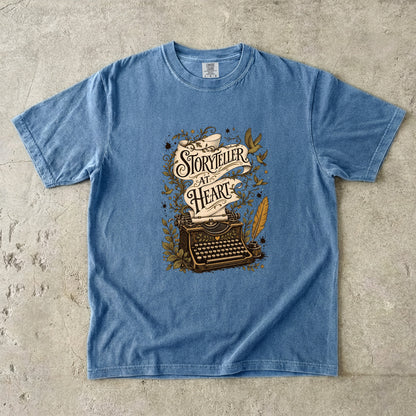 Storyteller at Heart writer shirt in Blue Jean with vintage typewriter and decorative storytelling artwork for writers.