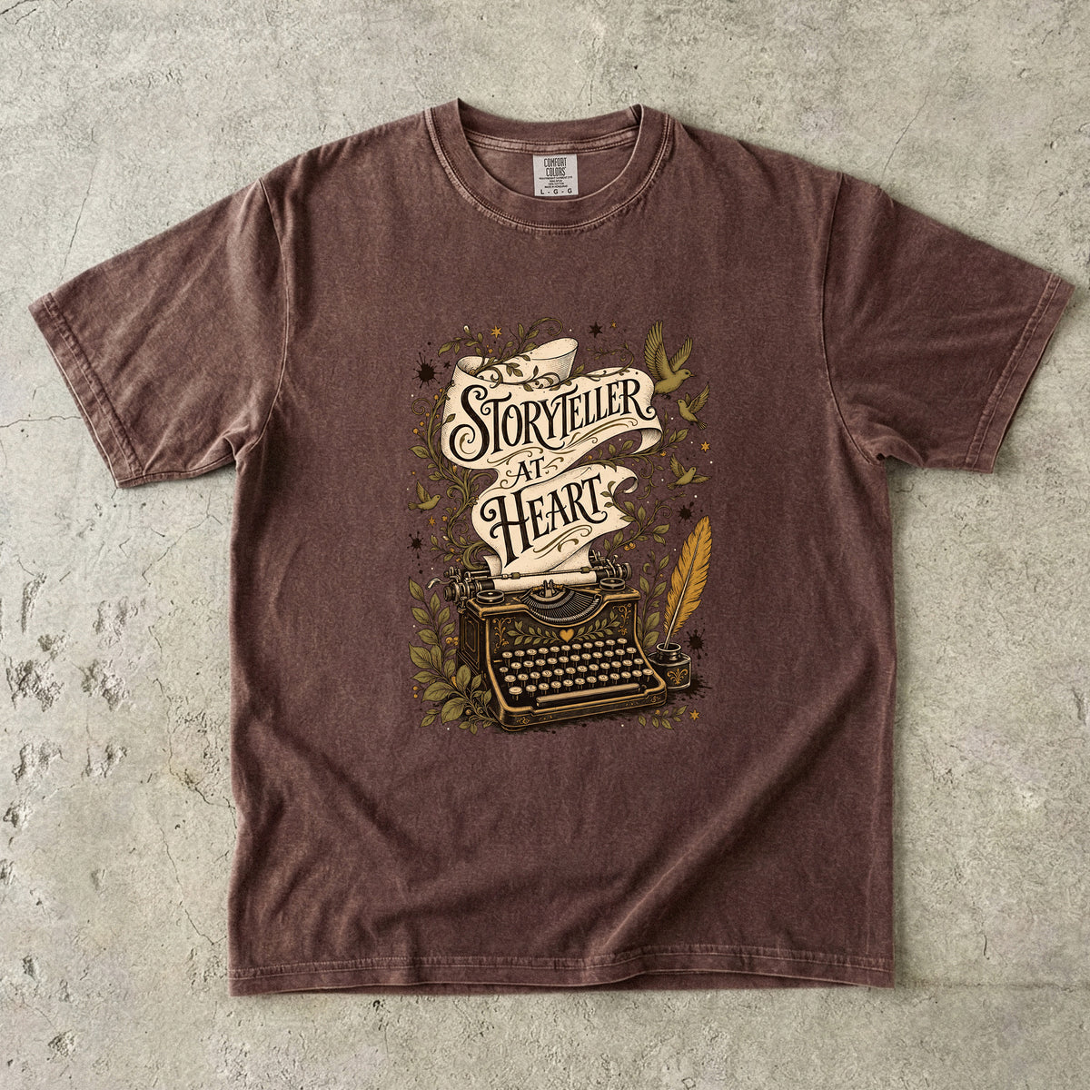 Storyteller at Heart writer shirt in Espresso featuring a vintage typewriter, manuscript scroll, quill, birds and botanical details.