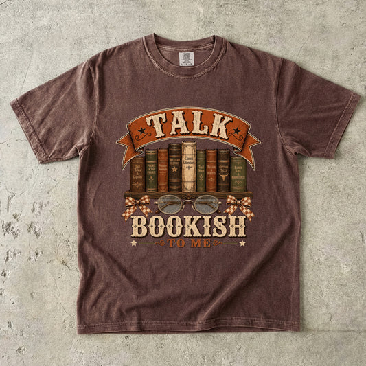 Espresso bookish T-shirt featuring Talk Bookish to Me with vintage books, reading glasses, checked bows and Western-inspired details.