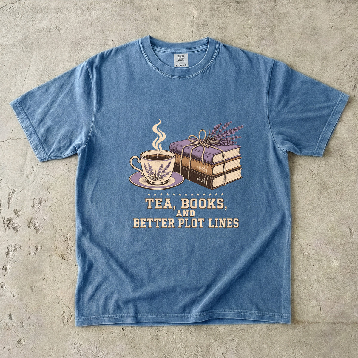Blue Jean reading T-shirt featuring Tea, Books, and Better Plot Lines with stacked books, a steaming lavender teacup and lavender sprigs.
