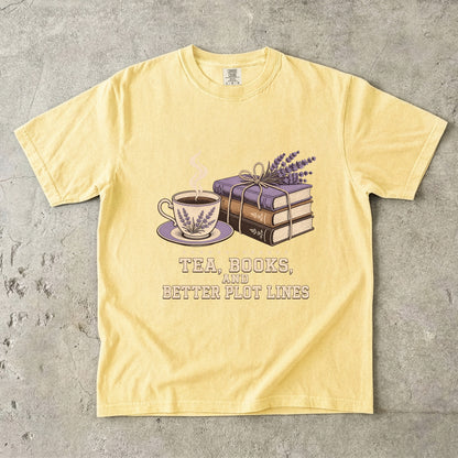 Butter reading T-shirt featuring Tea, Books, and Better Plot Lines with stacked books, a steaming lavender teacup and lavender sprigs.
