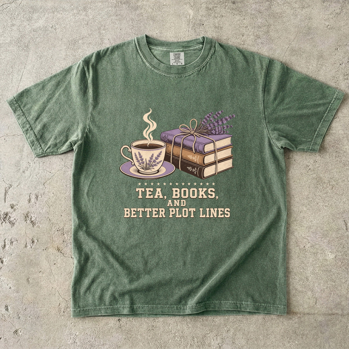 Moss reading T-shirt featuring Tea, Books, and Better Plot Lines with stacked books, a steaming lavender teacup and lavender sprigs.