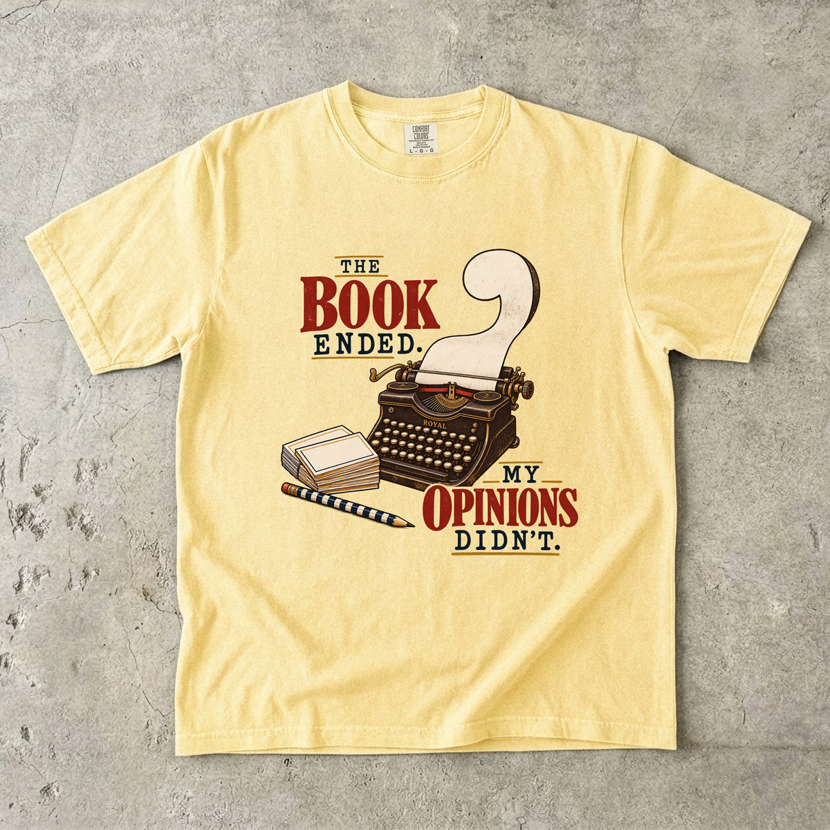 Butter reader T-shirt with “The Book Ended. My Opinions Didn’t.” and a vintage typewriter illustration