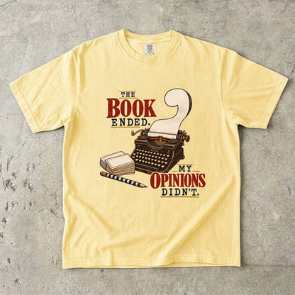 Butter reader T-shirt with “The Book Ended. My Opinions Didn’t.” and a vintage typewriter illustration