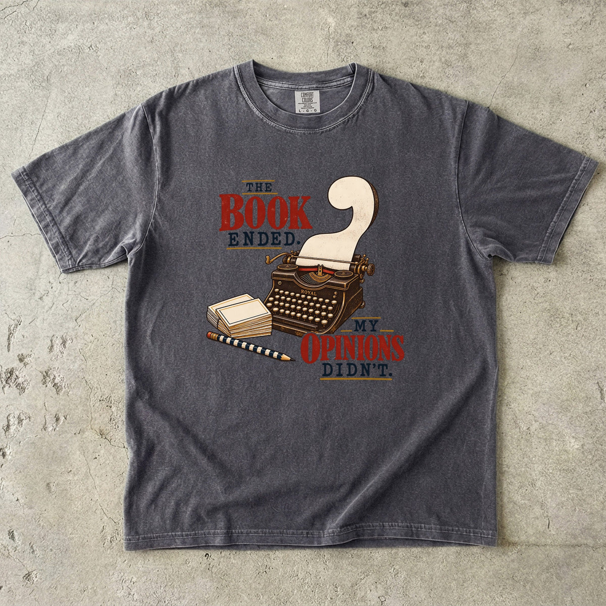 Pepper reader T-shirt with “The Book Ended. My Opinions Didn’t.” and a vintage typewriter illustration