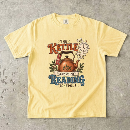 Butter reading T-shirt with “The Kettle Knows My Reading Schedule” and an illustrated copper kettle